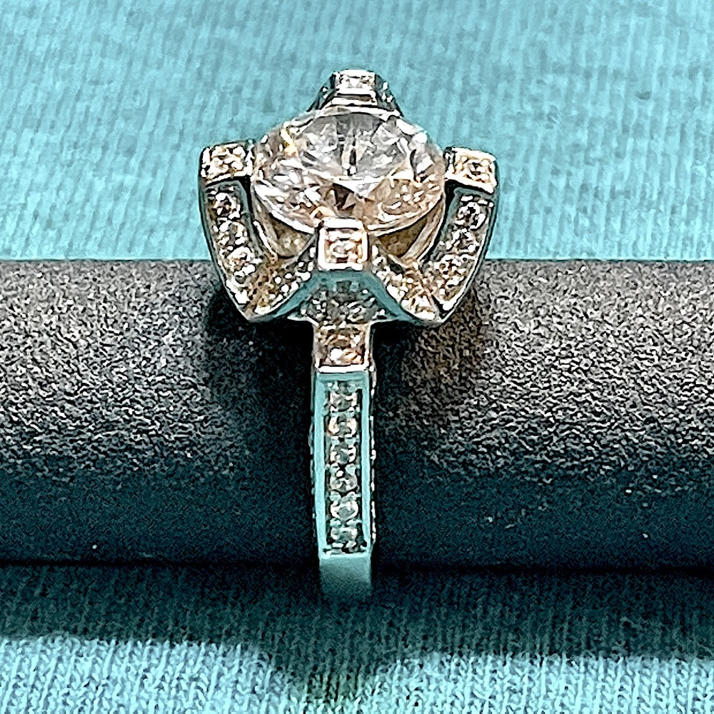925 Silver CZ and PAJ markings on this Engagement/cocktail Ring.